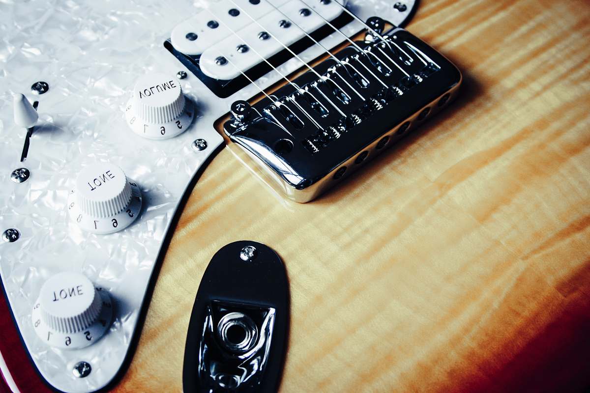 musical instrument gray and beige electric guitar leisure activities